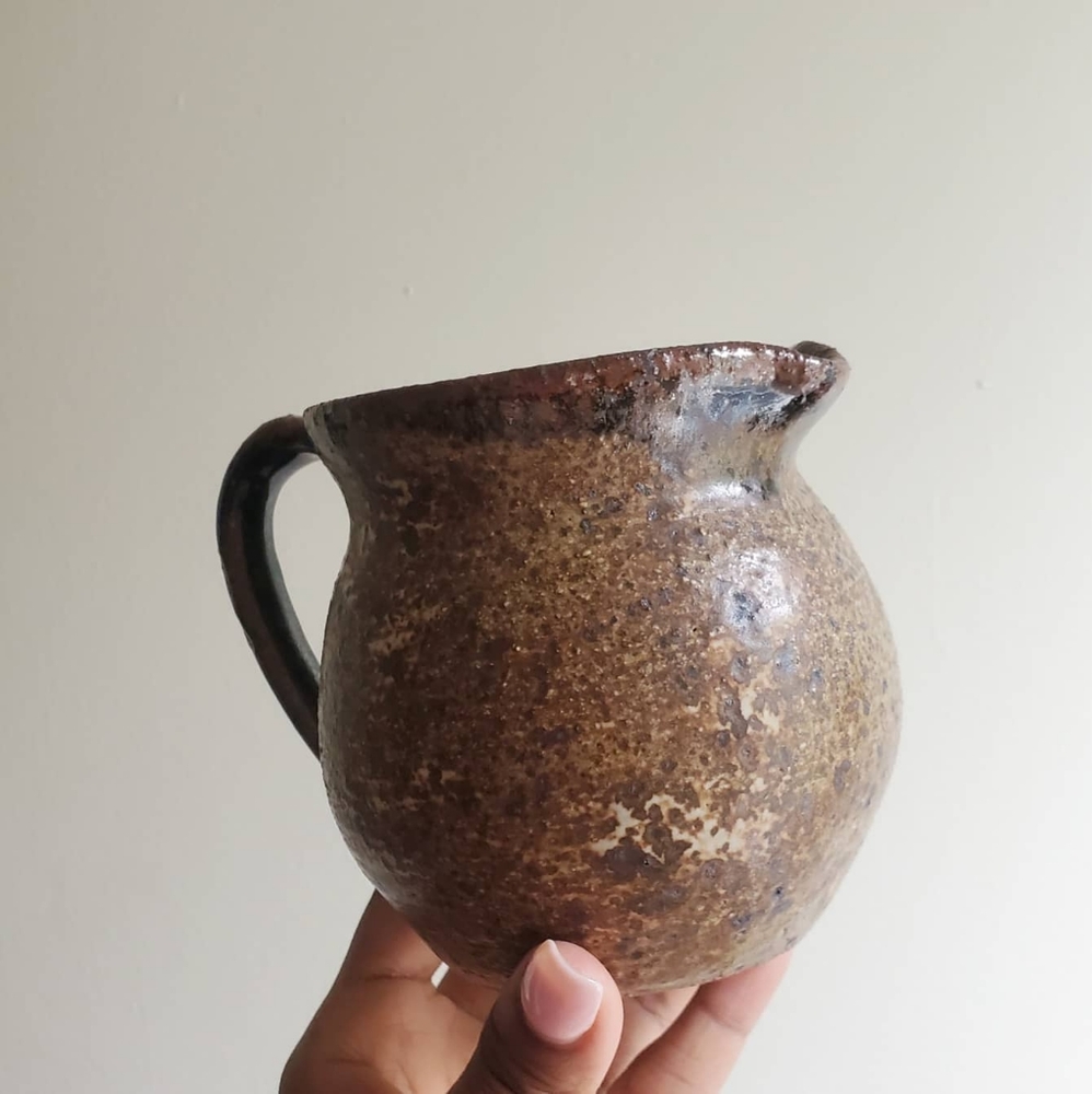 Handmade small clay pitcher